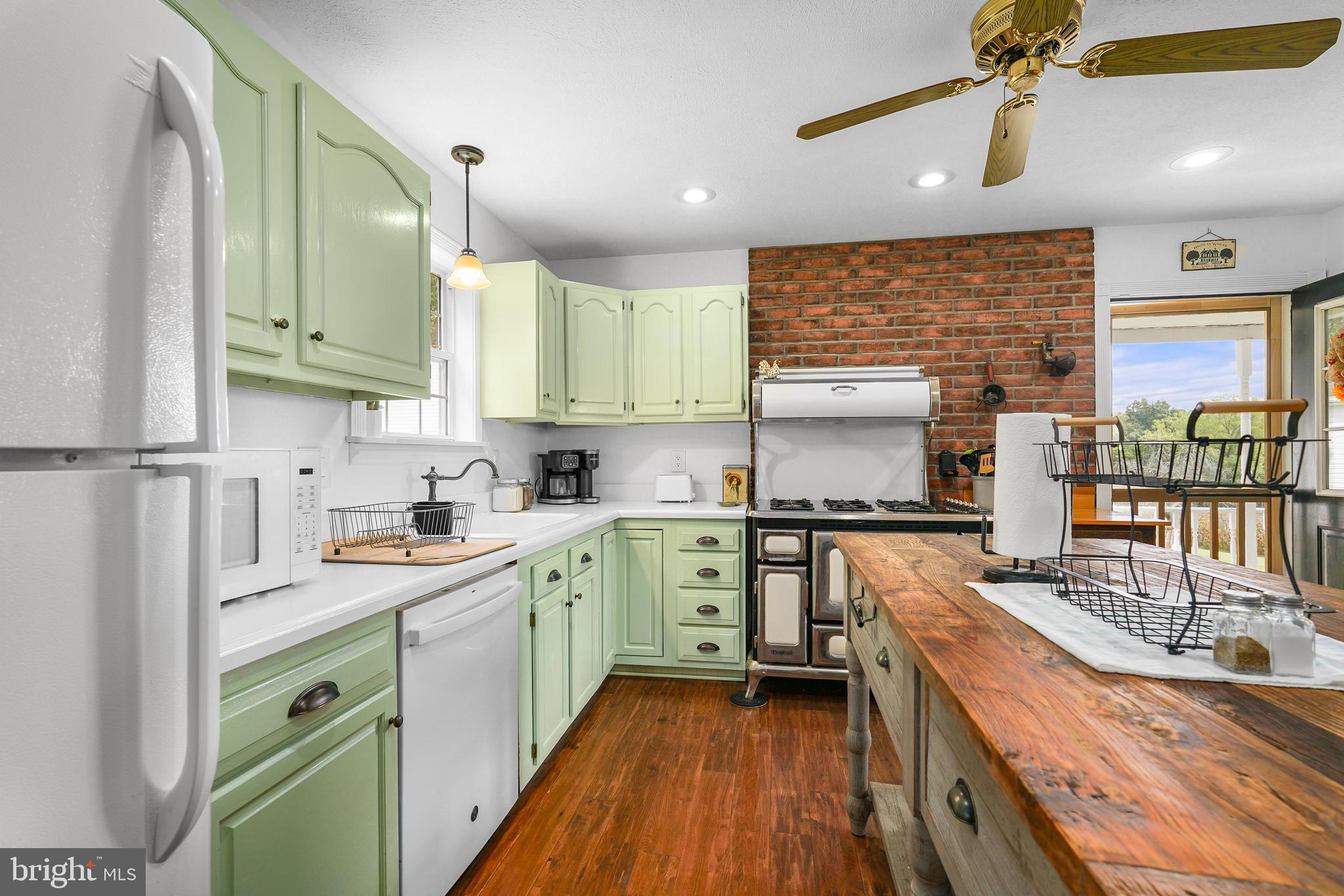 424 Springhill Road Rising Sun, MD 21911 - Photo 26 of 42 a kitchen with a sink stove and cabinets