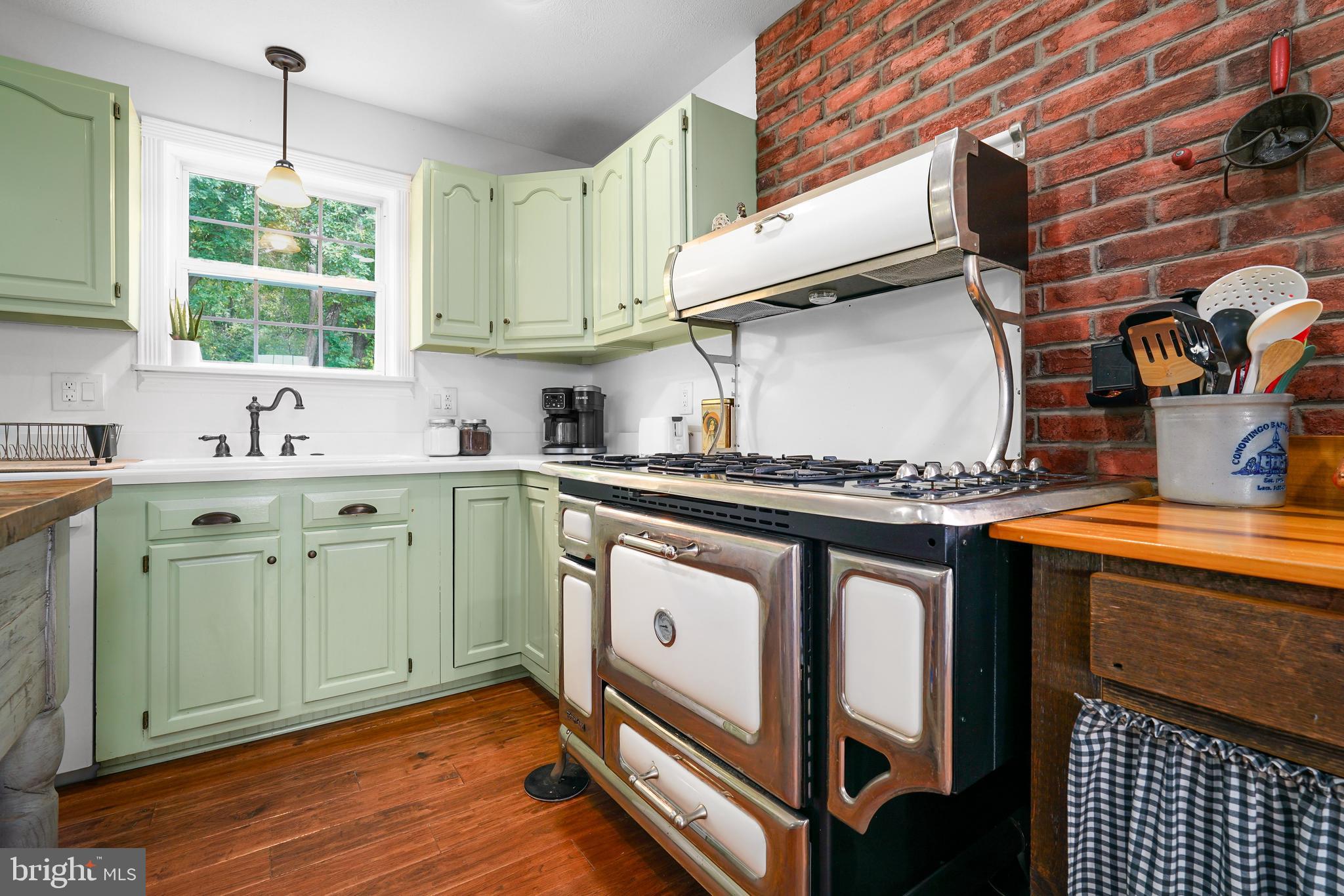 424 Springhill Road Rising Sun, MD 21911 - Photo 27 of 42 a kitchen with stainless steel appliances granite countertop a sink stove and cabinets