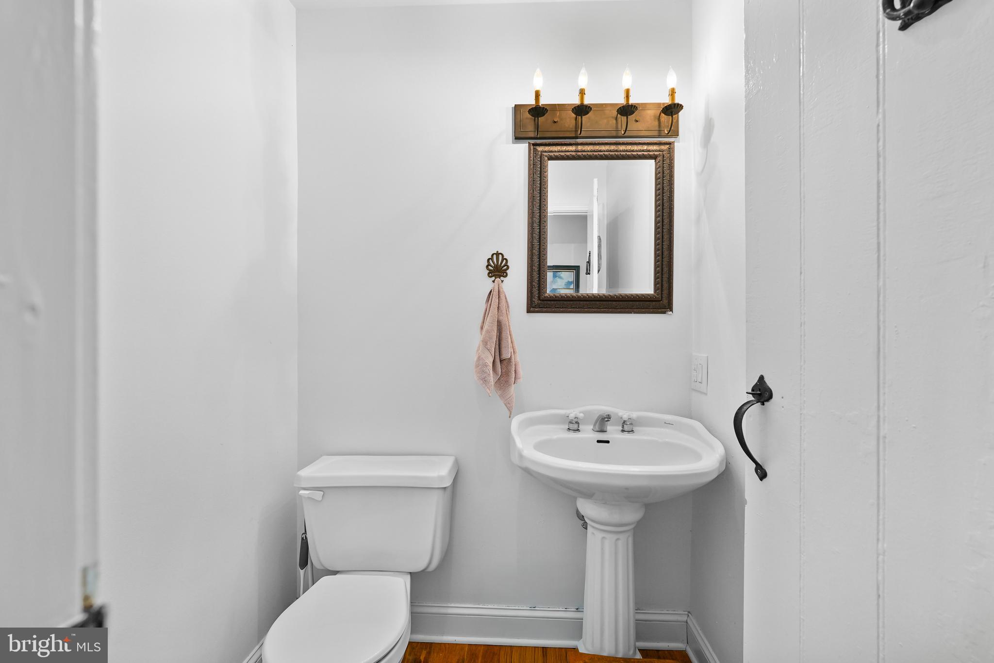 424 Springhill Road Rising Sun, MD 21911 - Photo 29 of 42 a bathroom with a toilet a sink and mirror