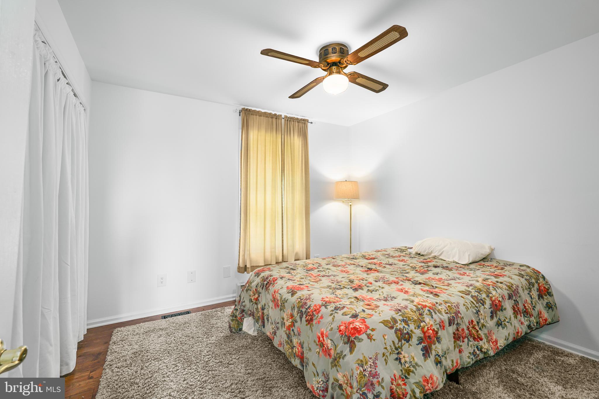 424 Springhill Road Rising Sun, MD 21911 - Photo 32 of 42 a bedroom with a bed and a large mirror