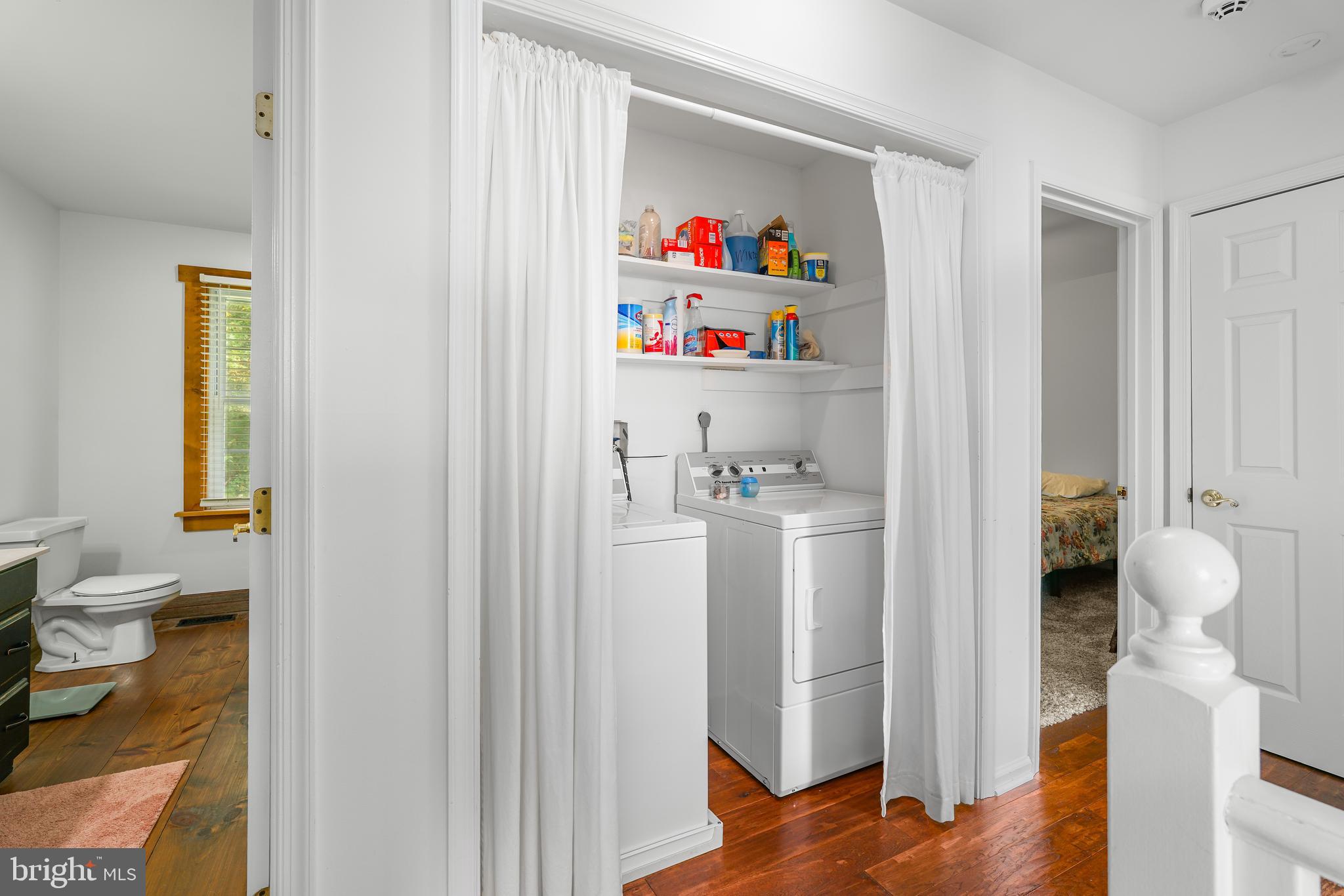 424 Springhill Road Rising Sun, MD 21911 - Photo 42 of 42 a room with a refrigerator and a wooden floor