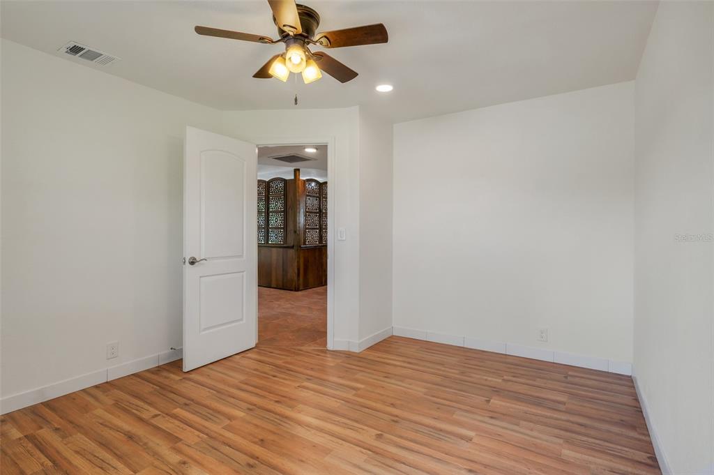 13832 South Bay Lake Road Groveland, FL 34736 - Photo 27 of 55 a view of empty room with wooden floor