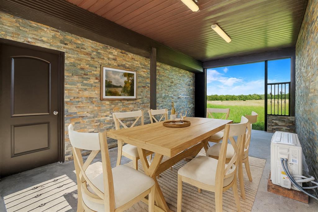 13832 South Bay Lake Road Groveland, FL 34736 - Photo 35 of 55 a view of a patio with table and chairs