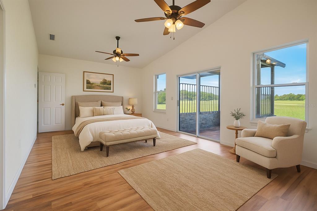 13832 South Bay Lake Road Groveland, FL 34736 - Photo 4 of 55 a bedroom with a bed and ceiling fan
