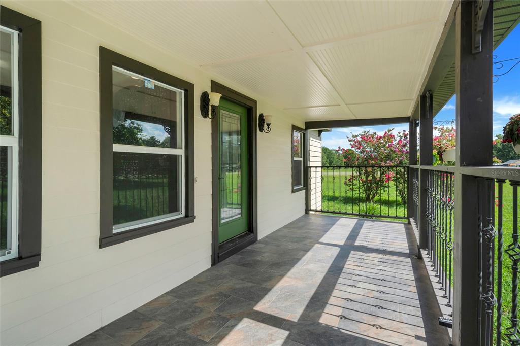 13832 South Bay Lake Road Groveland, FL 34736 - Photo 10 of 55 a view of a house with a porch
