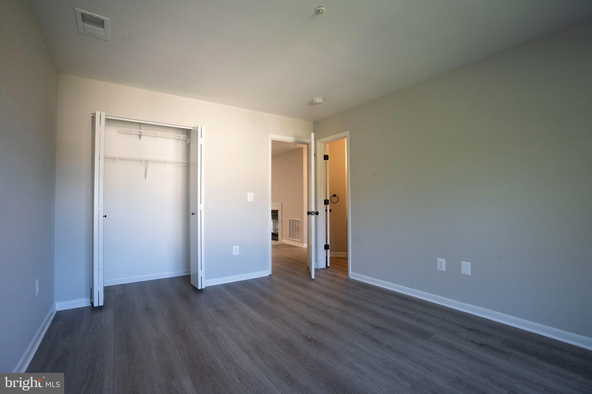 30 I Greystone Court, Unit I Annapolis, MD 21403 - Photo 12 of 15 a view of an empty room with wooden floor