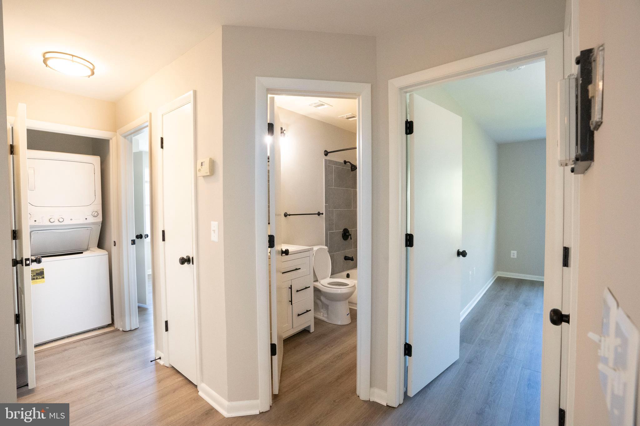 30 I Greystone Court, Unit I Annapolis, MD 21403 - Photo 13 of 15 wooden floor with white walls