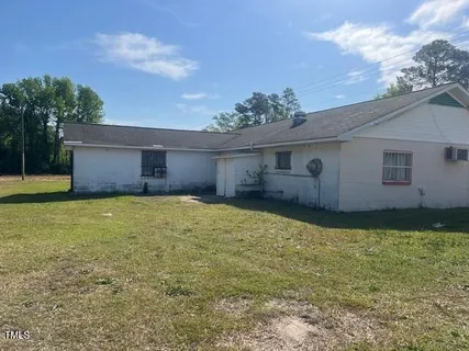 a white toilet sitting next to a bathroom sink
