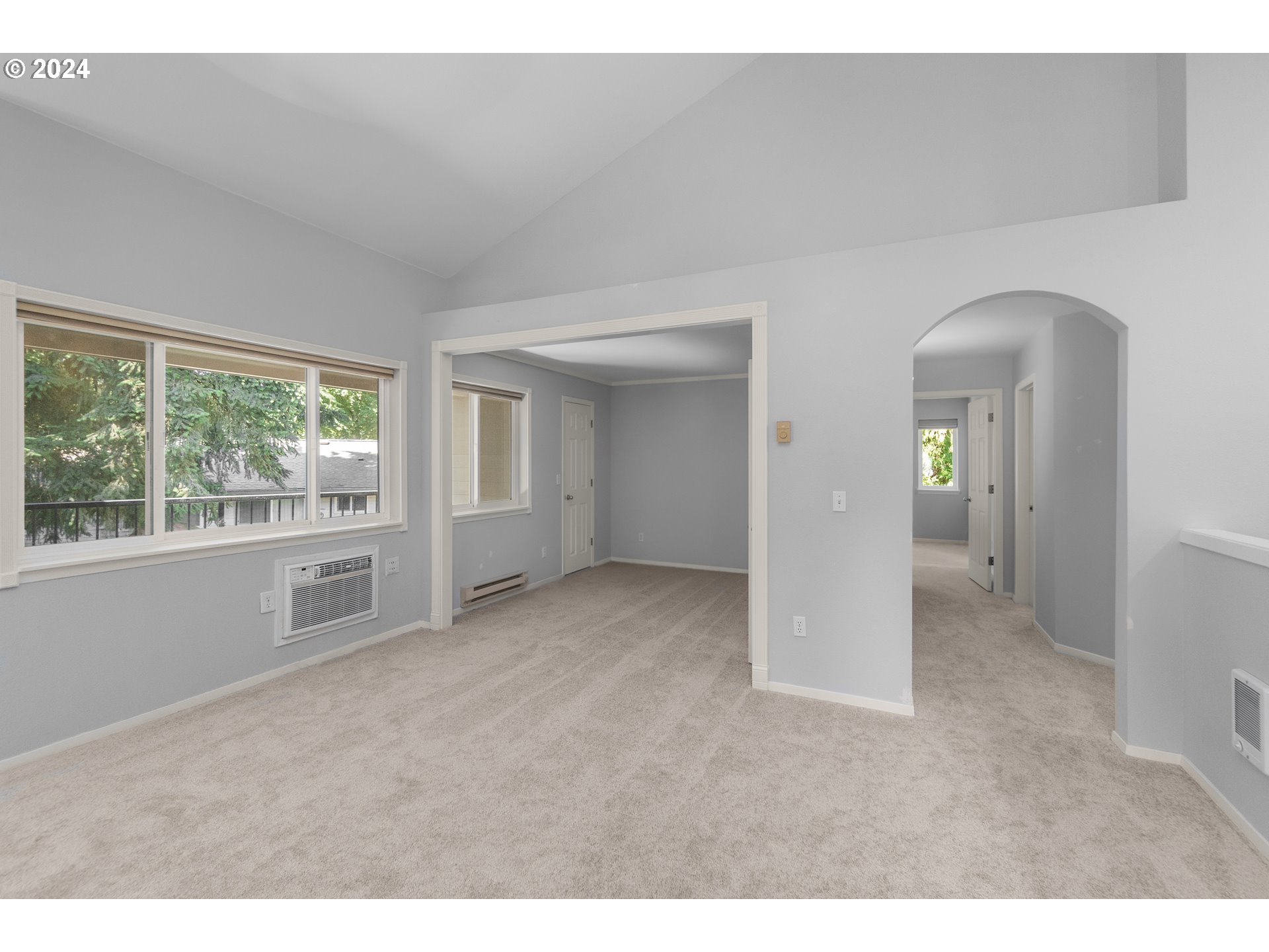 5225 Jean Road, Unit 312 Lake Oswego, OR 97035 - Photo 4 of 21 a view of an empty room with window and bathroom