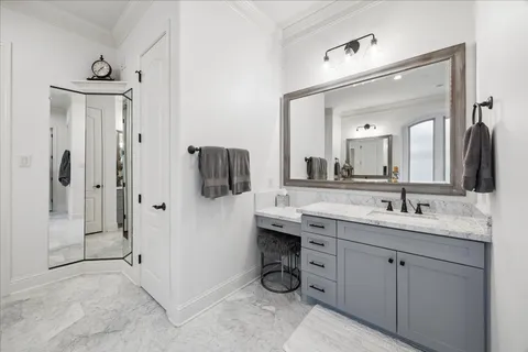 a spacious bathroom with a granite countertop sink mirror and shower