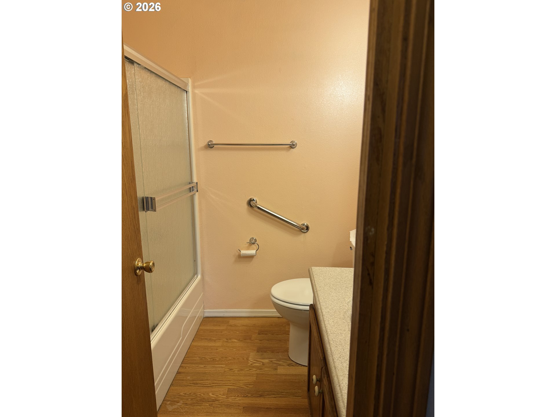 870 12th Street Southwest Bandon, OR 97411 - Photo 11 of 25 a bathroom with a granite countertop shower and a toilet