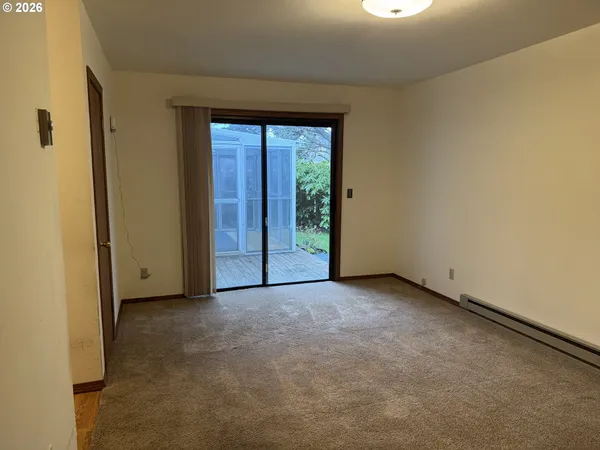 a view of an empty room with a window