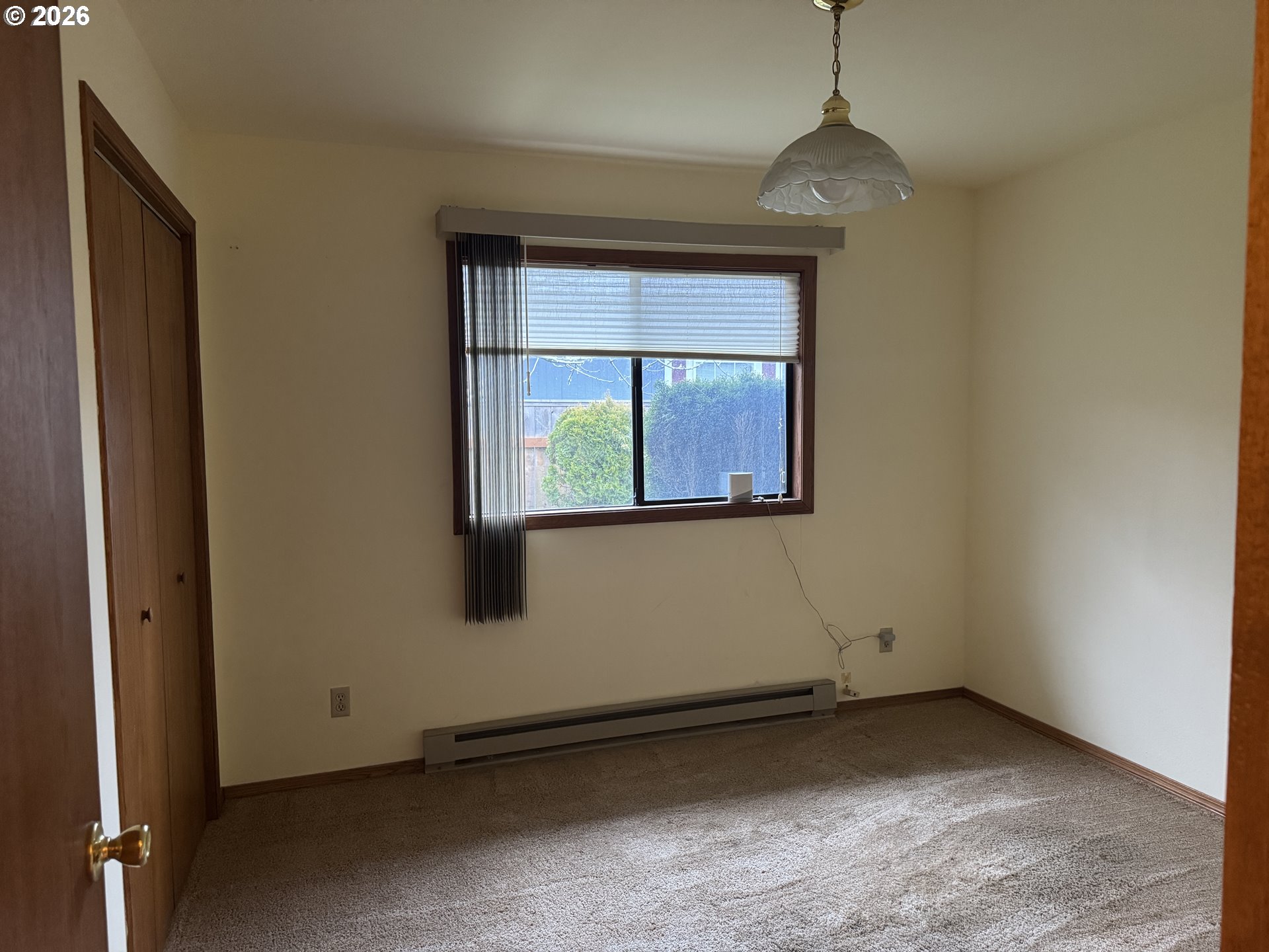 870 12th Street Southwest Bandon, OR 97411 - Photo 9 of 25 an empty room with a window