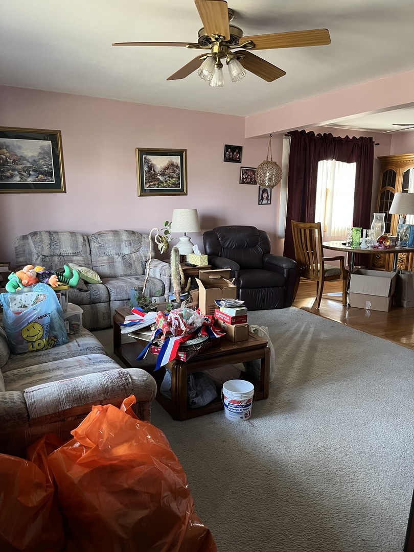 11034 Major Avenue Chicago Ridge, IL 60415 - Photo 2 of 6 a living room with furniture and a chandelier