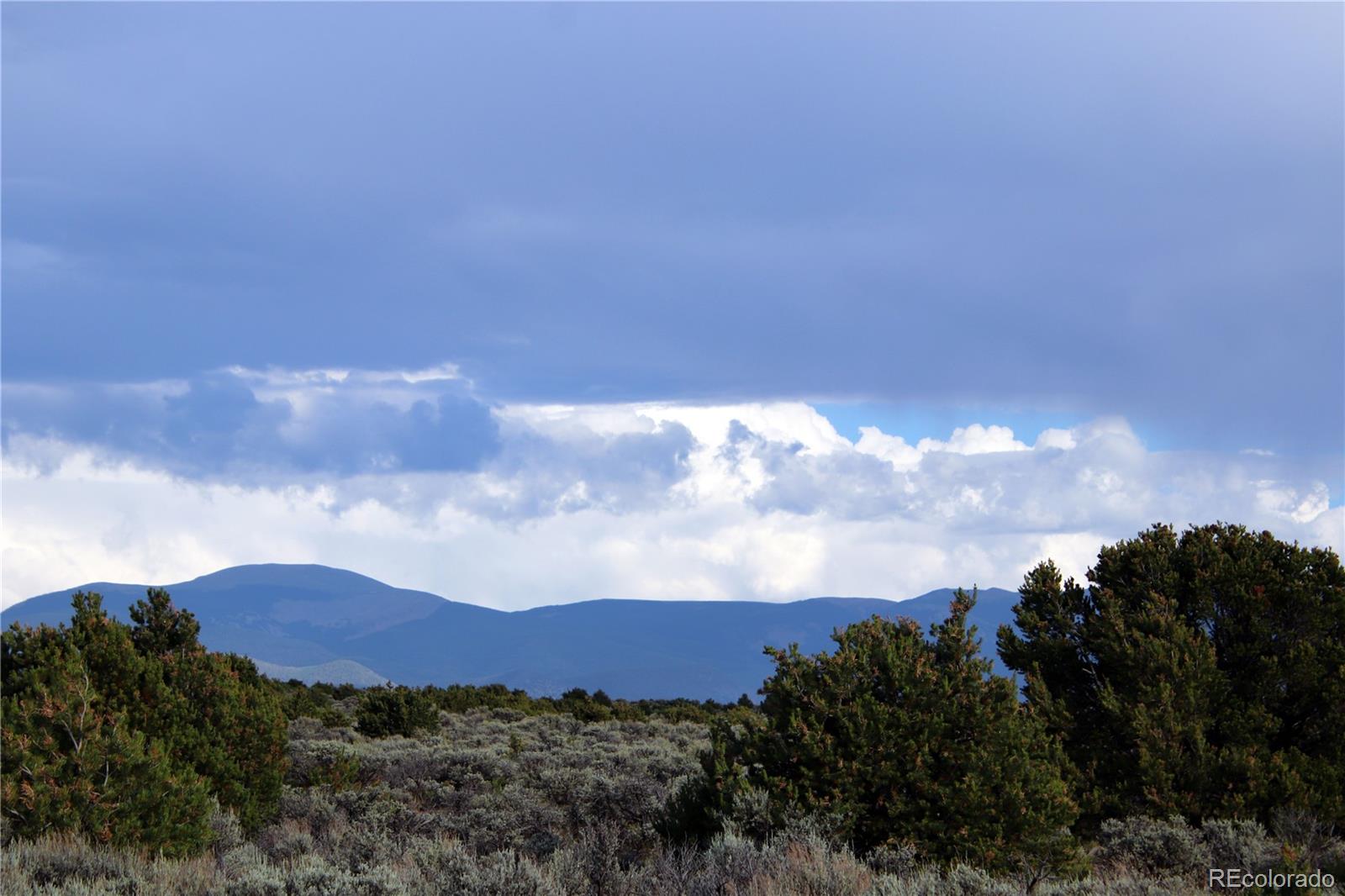 5 North Canyon Road San Luis, CO 81152 - Photo 7 of 25 a view of a city with green space and mountain view in back