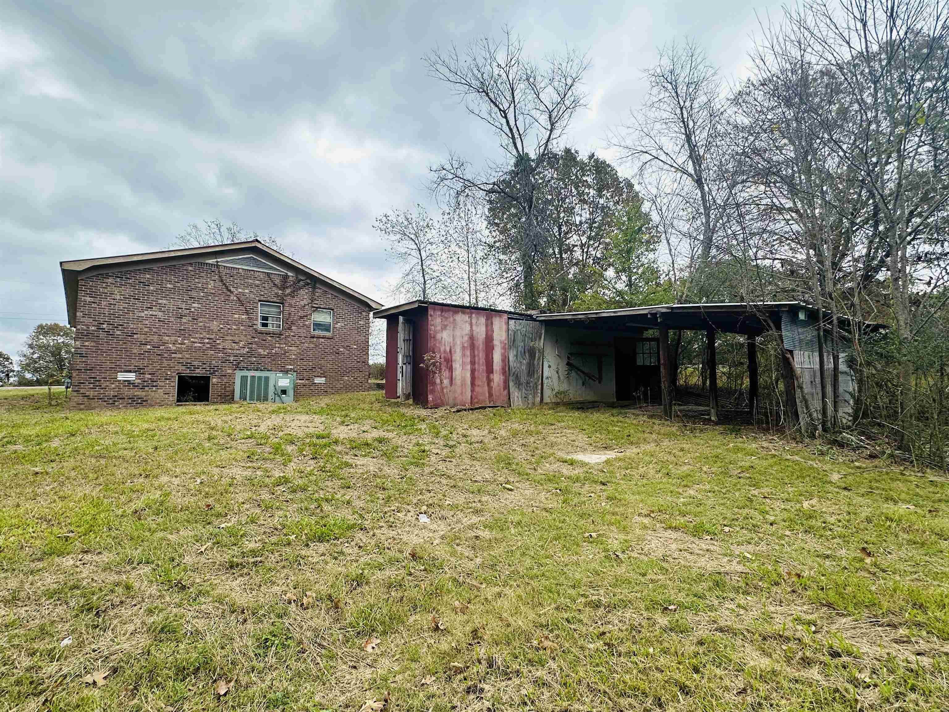 505 Patterson Lane Finger, TN 38334 - Photo 13 of 23 a front view of house with yard and trees in the background