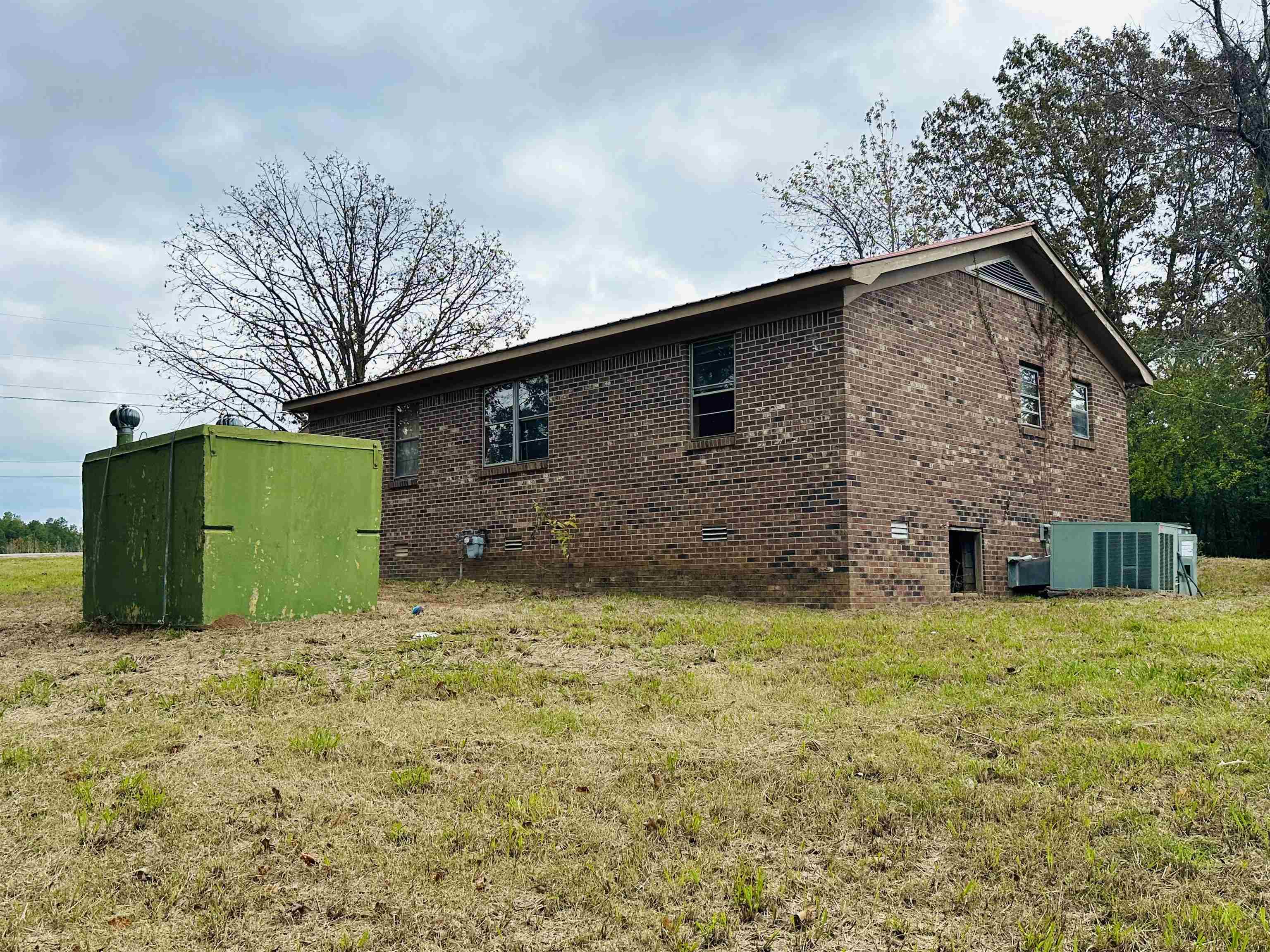 505 Patterson Lane Finger, TN 38334 - Photo 14 of 23 a view of a house with a large tree