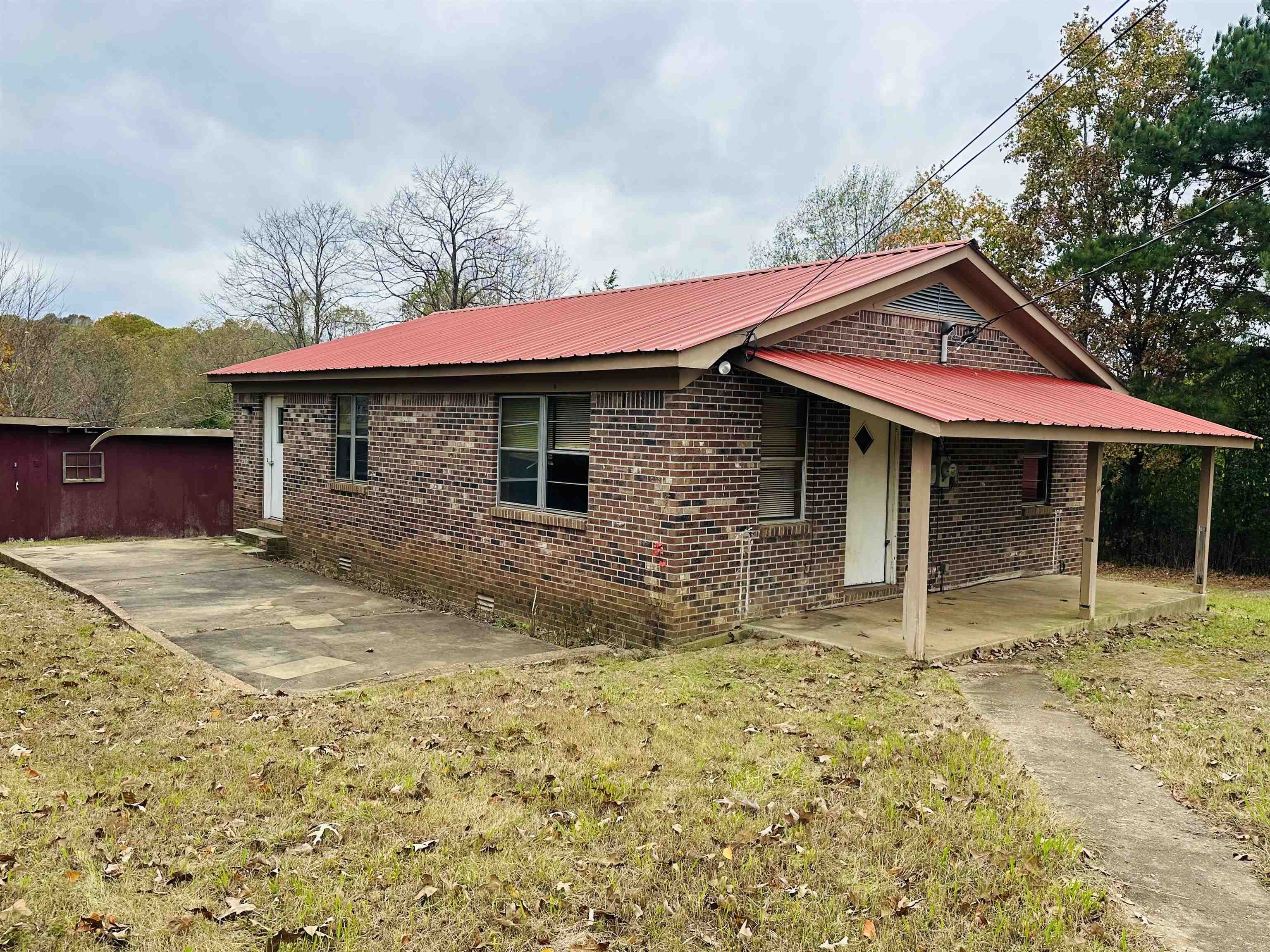 505 Patterson Lane Finger, TN 38334 - Photo 16 of 23 a front view of a house with a yard