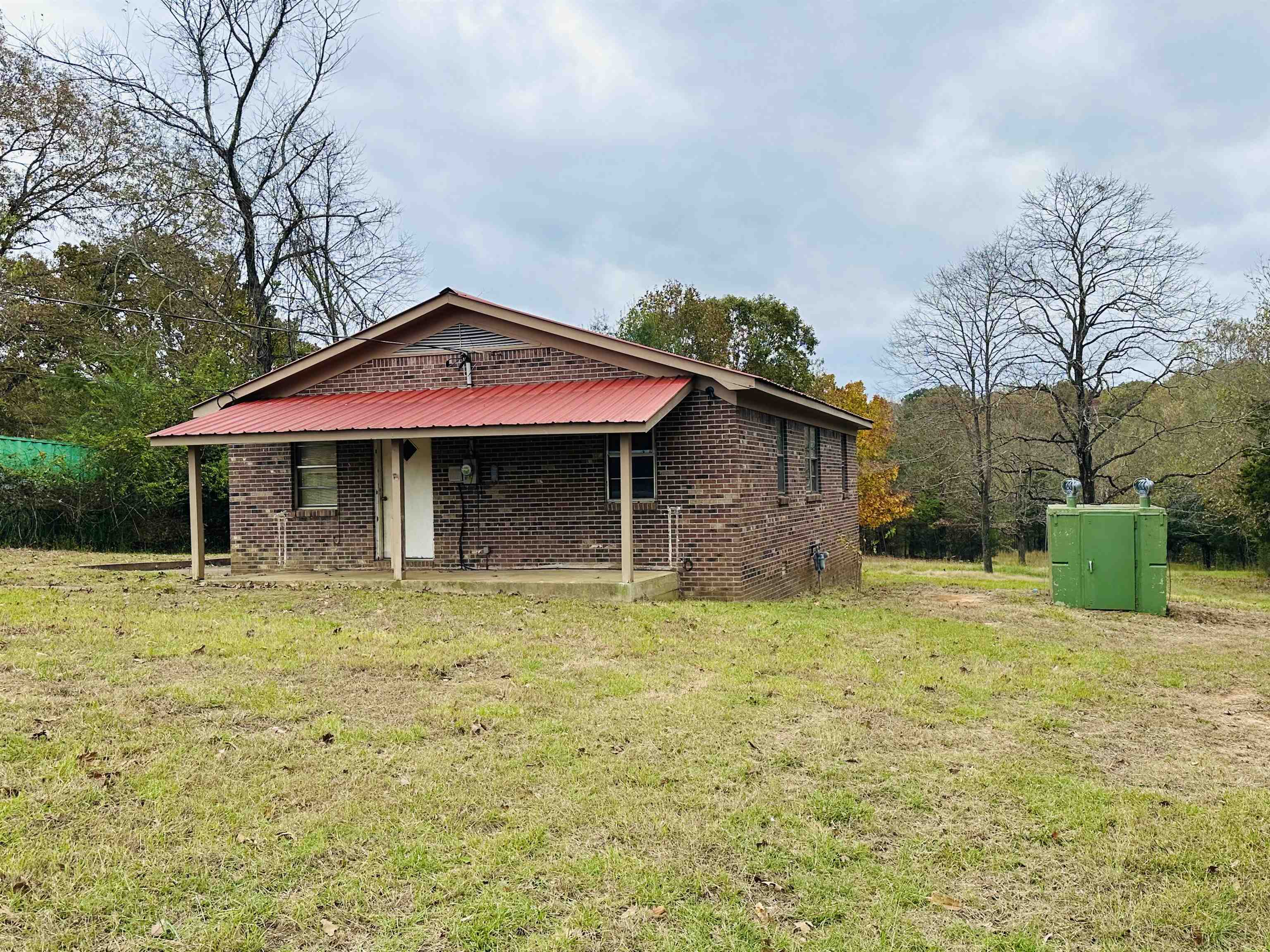505 Patterson Lane Finger, TN 38334 - Photo 18 of 23 a front view of a house with a yard