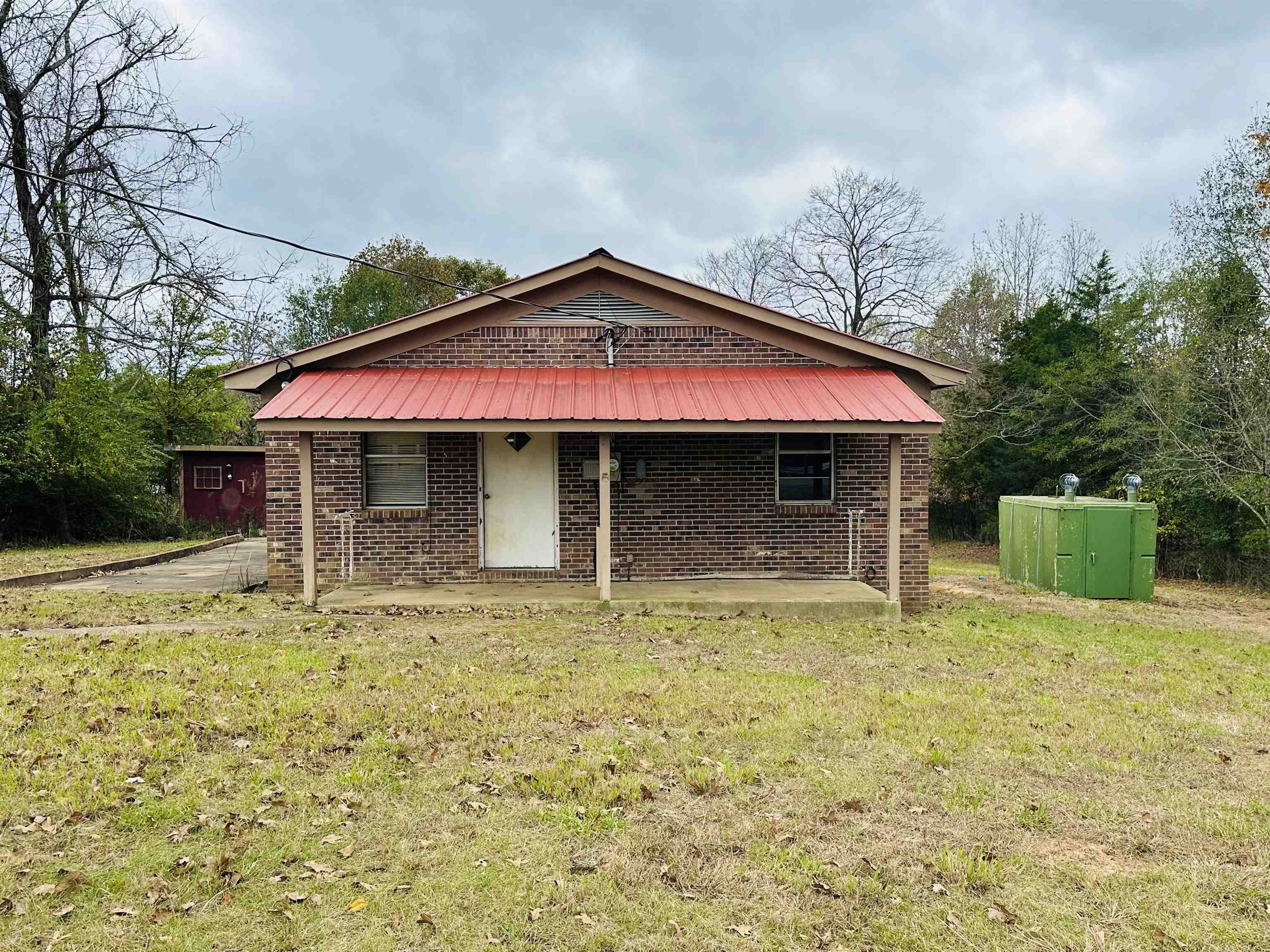 505 Patterson Lane Finger, TN 38334 - Photo 19 of 23 a view of house with yard and sitting area