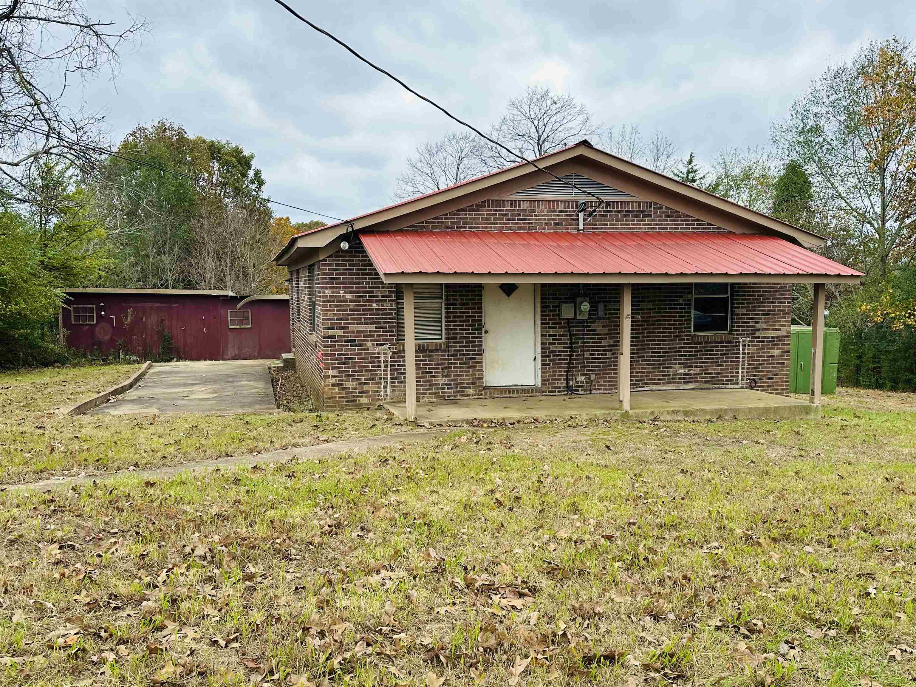 505 Patterson Lane Finger, TN 38334 - Photo 20 of 23 a front view of a house with a yard