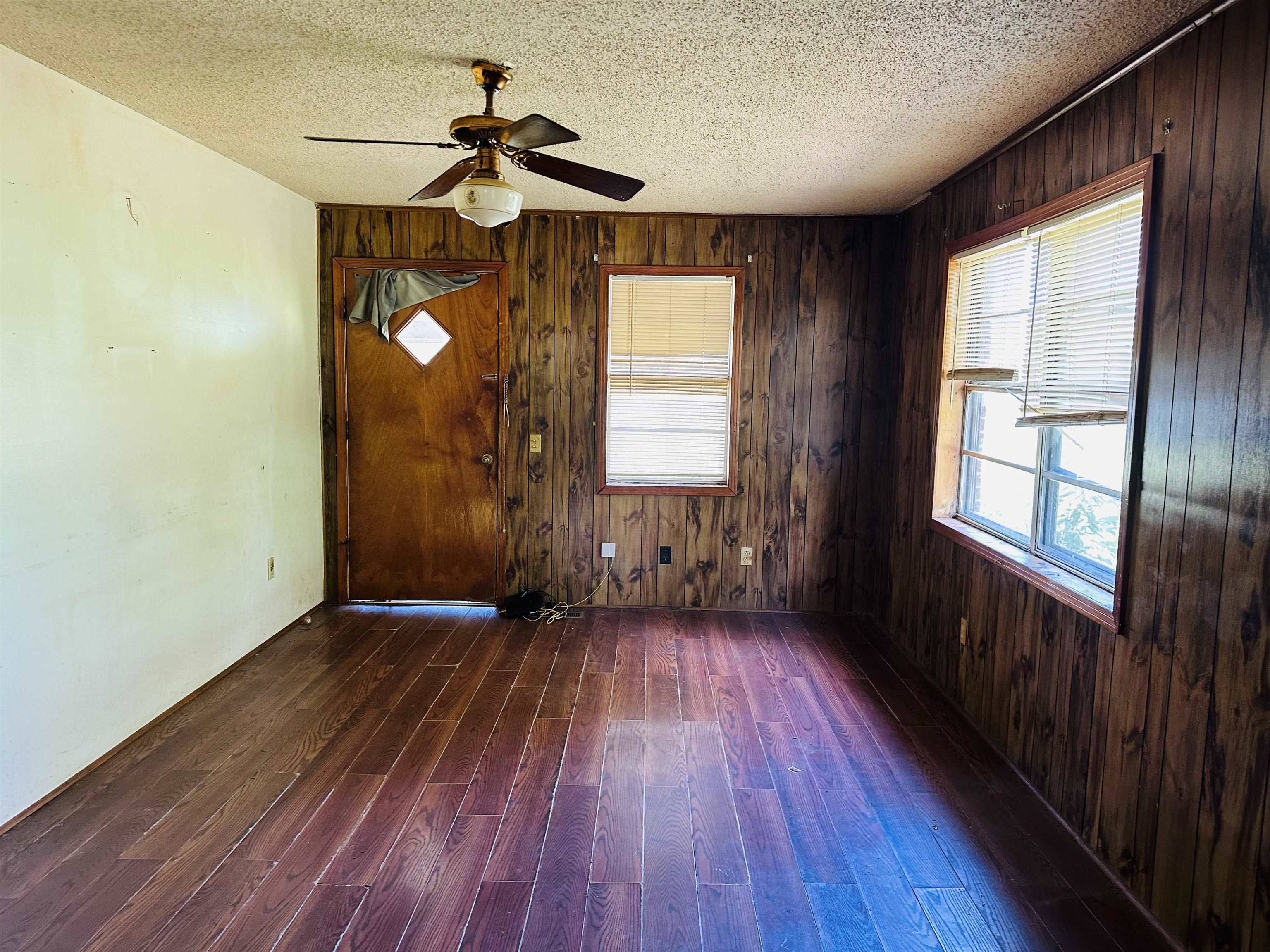 505 Patterson Lane Finger, TN 38334 - Photo 2 of 23 a view of empty room with wooden floor and fan