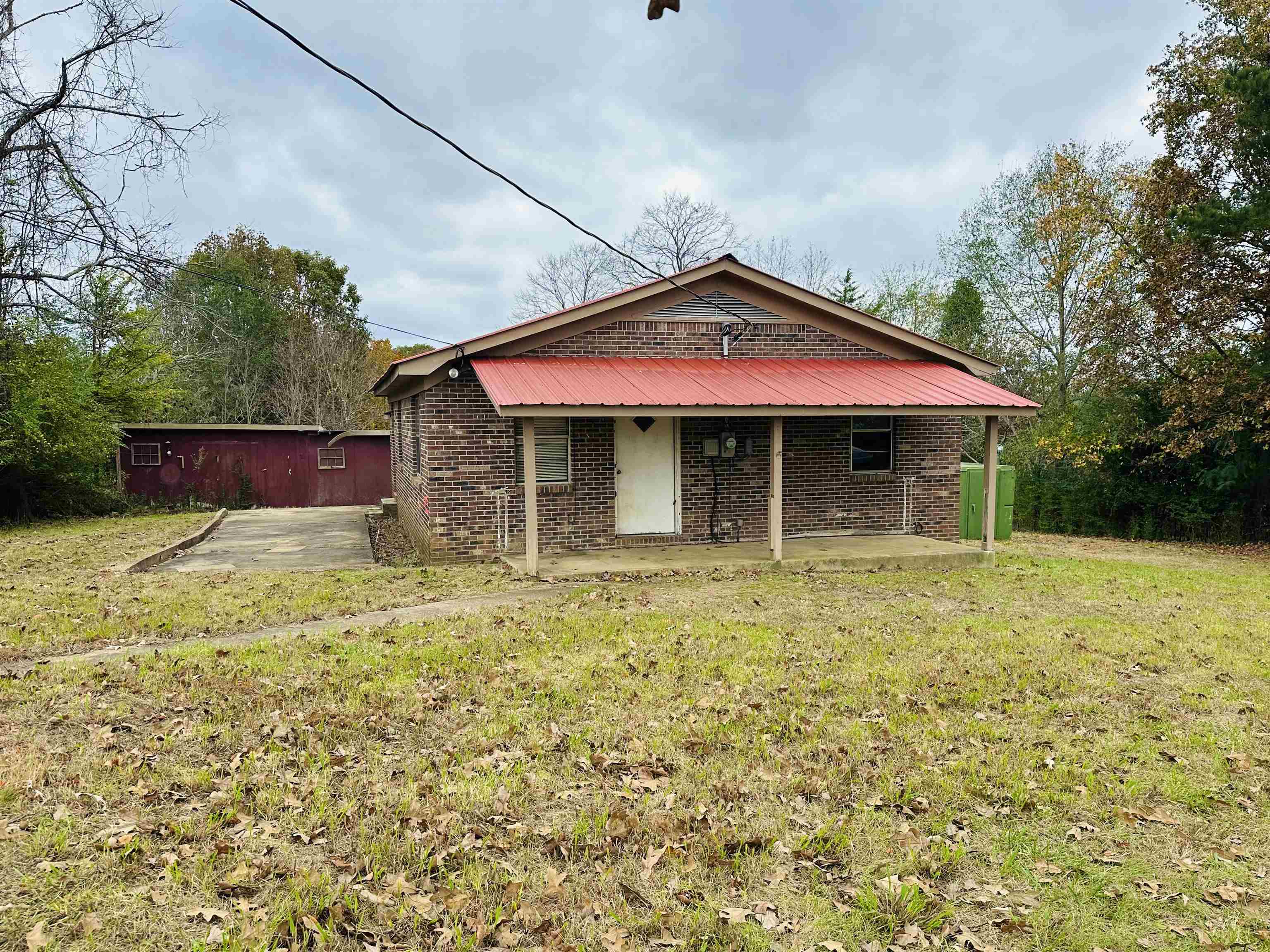 505 Patterson Lane Finger, TN 38334 - Photo 21 of 23 a front view of a house with a yard