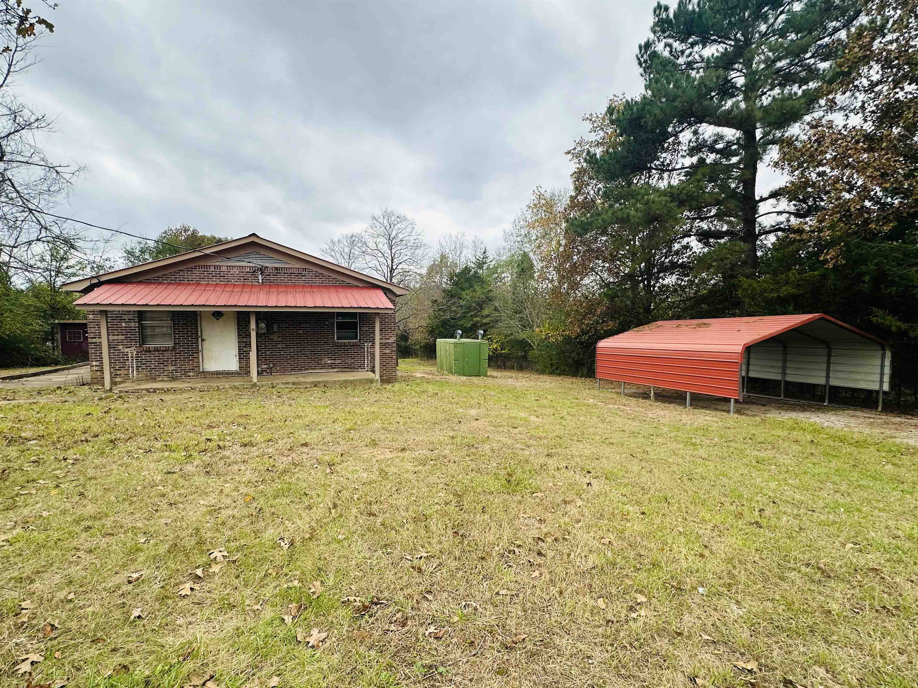505 Patterson Lane Finger, TN 38334 - Photo 22 of 23 a front view of a house with a yard