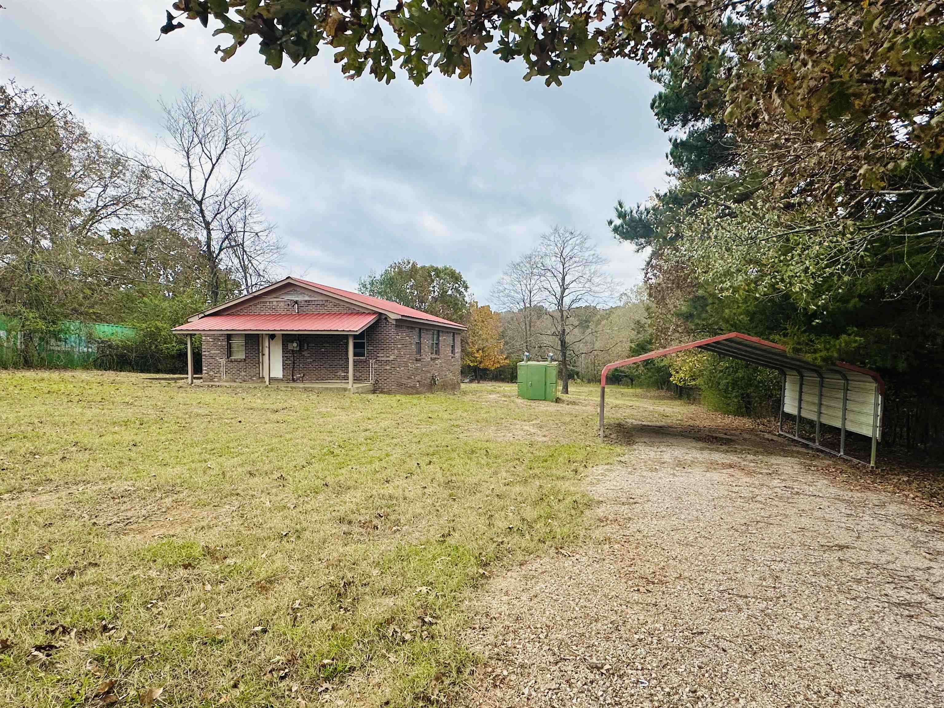 505 Patterson Lane Finger, TN 38334 - Photo 23 of 23 a backyard of a house with table and chairs