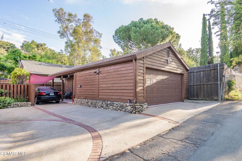 6078 Peppertree Lane Simi Valley, CA 93063 - Photo 43 of 59 a view of a house with a garage