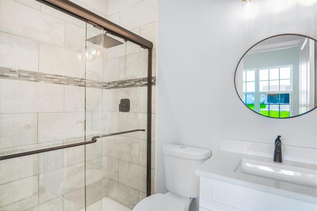 4540 Southwest 170th Street Road Ocala, FL 34473 - Photo 24 of 34 a bathroom with a sink and a mirror