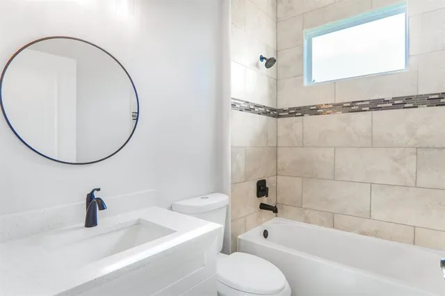 an empty room with wooden floor and closet