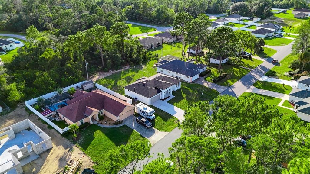 4540 Southwest 170th Street Road Ocala, FL 34473 - Photo 3 of 34 an aerial view of multiple houses with yard