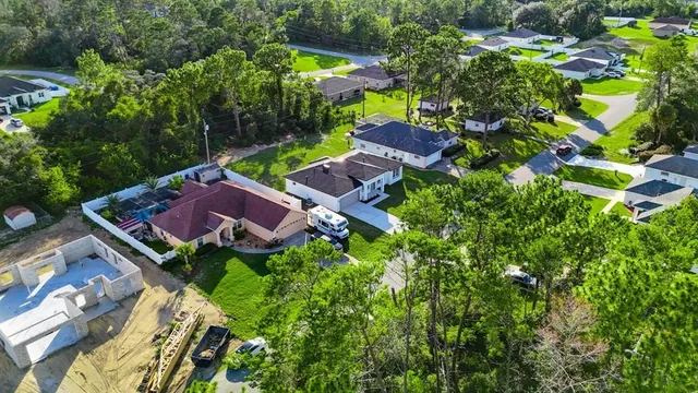 an aerial view of a house with a garden