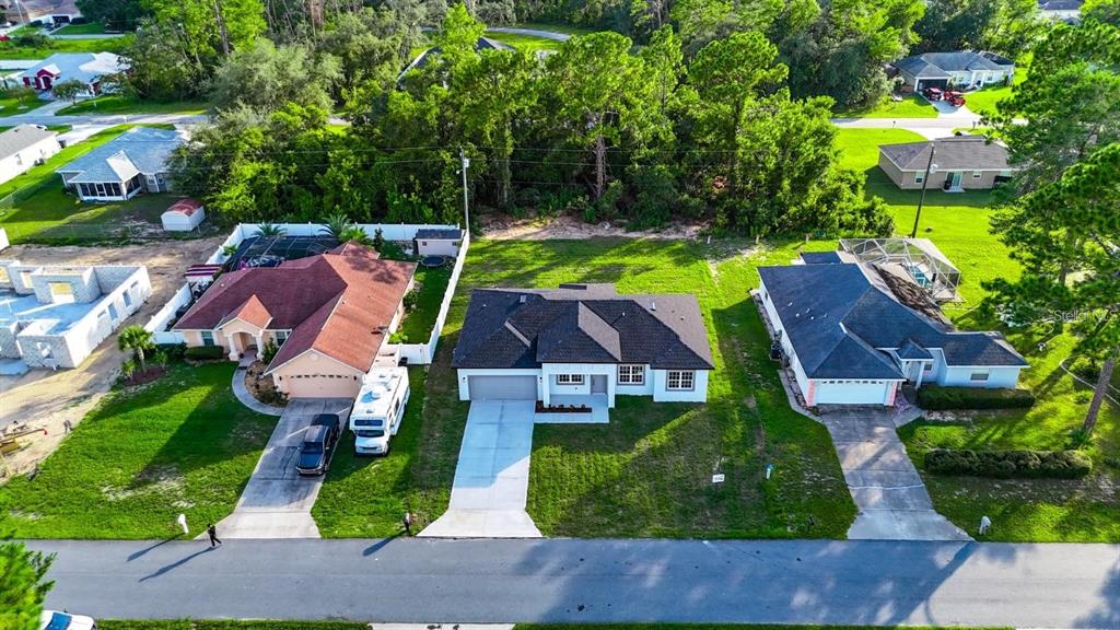 4540 Southwest 170th Street Road Ocala, FL 34473 - Photo 8 of 34 an aerial view of multiple houses with yard