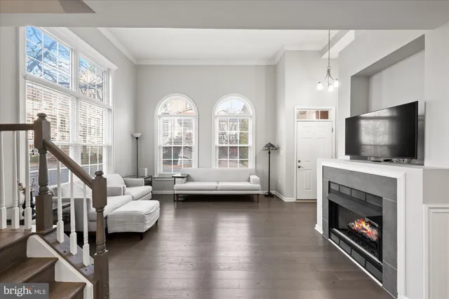 a living room with furniture fireplace and flat screen tv