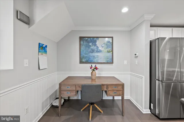 a workspace with furniture and window