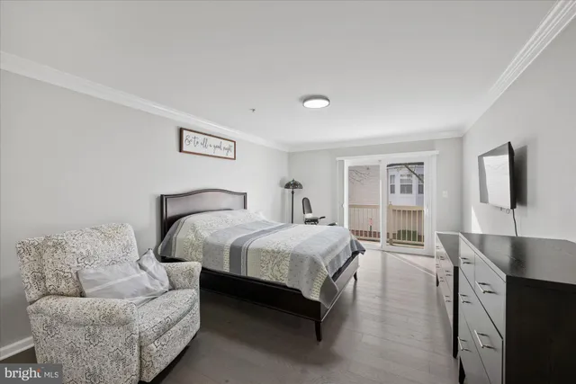 a spacious bedroom with a bed and couch