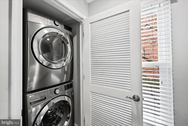 a view of a hallway with washer and dryer