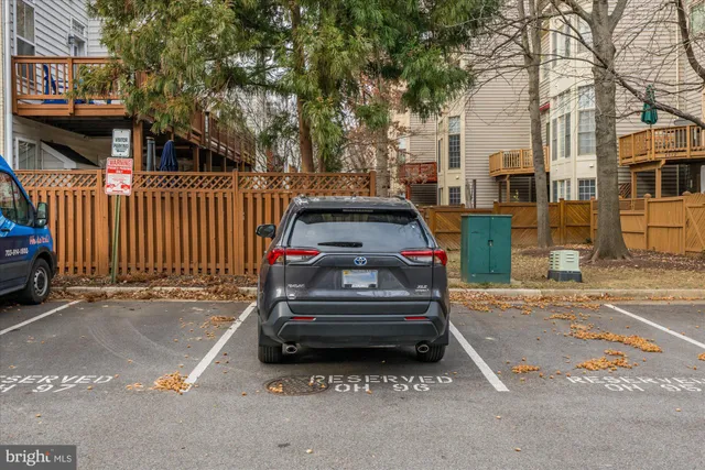 a view of a patio with a table and chairs and potted plants