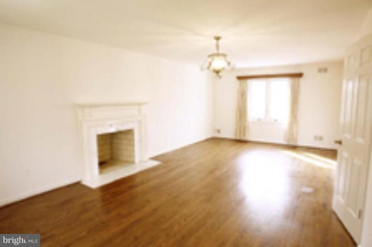 21815 Woodfield Road Gaithersburg, MD 20882 - Photo 15 of 29 Master bedroom has a wood-burning fireplace.