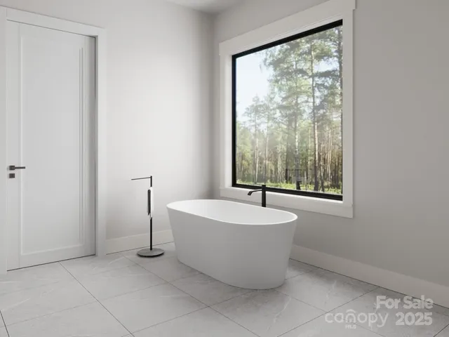 a spacious bathroom with a bathtub and window
