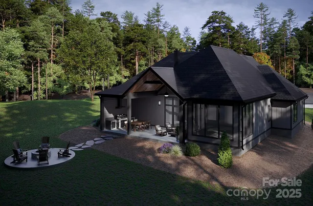 a view of a house with backyard and sitting area