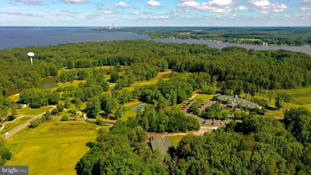 a view of a lake and green valley