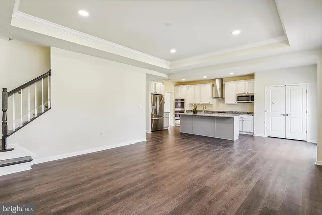 a view of kitchen with wooden floor and window