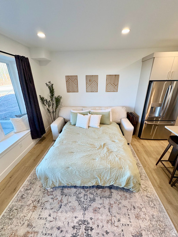 70 East Hwy 153, Unit A4 Beaver, UT 84713 - Photo 13 of 19 Bedroom featuring stainless steel refrigerator with ice dispenser, light wood-style floors, and recessed lighting