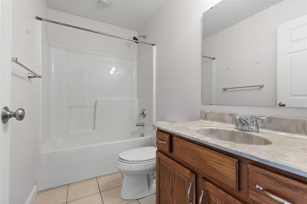 1 Coraopolis Road Coraopolis, PA 15108 - Photo 11 of 24 a bathroom with a granite countertop sink a toilet and shower
