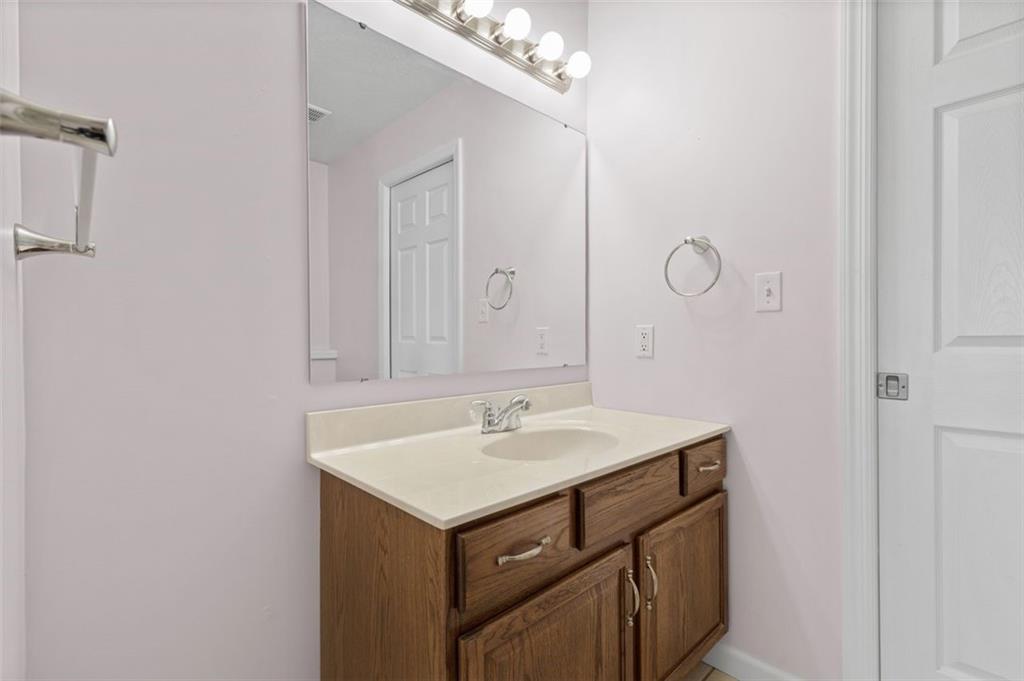 1 Coraopolis Road Coraopolis, PA 15108 - Photo 18 of 24 a bathroom with a sink and a mirror