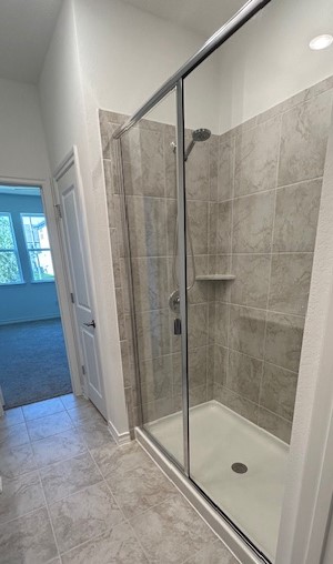 125 Watkinville Road Hutto, TX 78634 - Photo 11 of 17 a bathroom with a shower