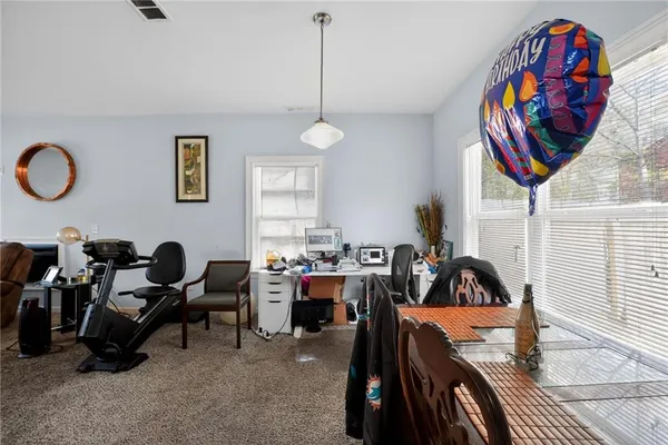 a bed room with a bed and a television